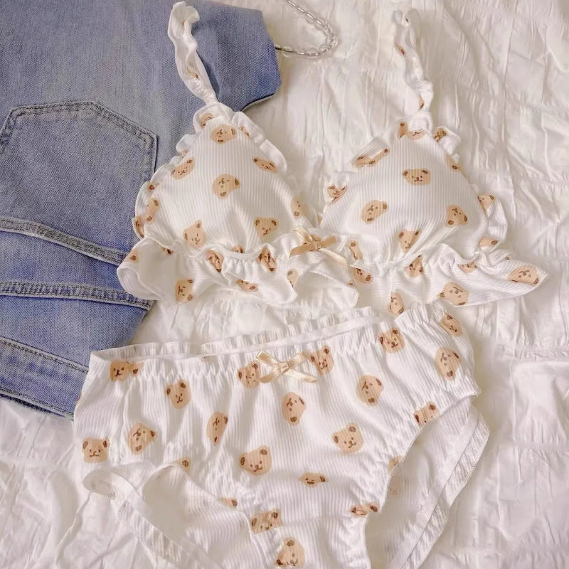 Kawaii Cute Bear Underwear Set laying on a bed with a pair of jeans 