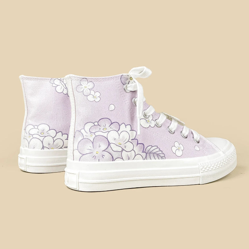 A pair of lavender high-top canvas sneakers with white floral prints, white laces, and white rubber soles, displayed against a solid beige background.