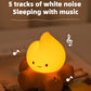 Cute night light with a smiling face on a surface, labeled '5 tracks of white noise Sleeping with music'.