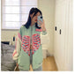 Girl wearing Kawaii Pastel Skeleton Heart Jacket