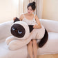 Woman holding a beige Kawaii sleepy cat body pillow plushie