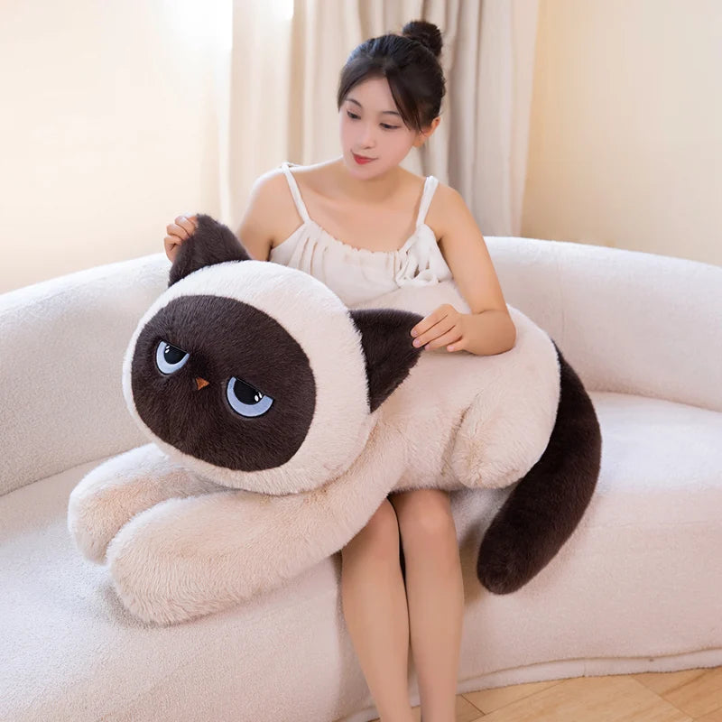 Woman holding a beige Kawaii sleepy cat body pillow plushie