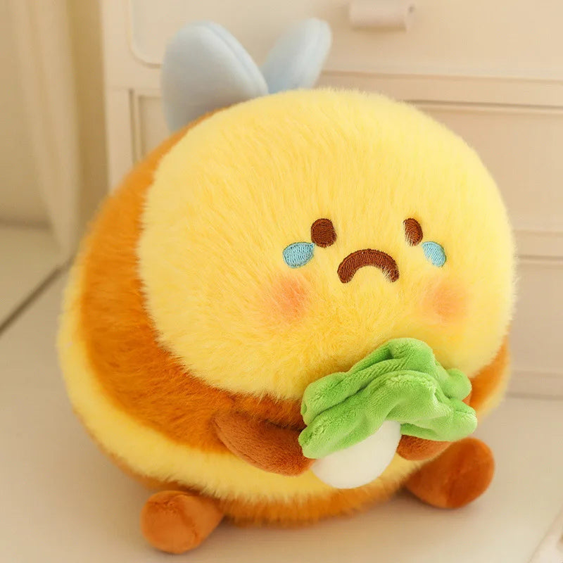 kawaii bee plushie with sad face on a cream color desk