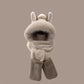 Plush animal-like head cover with ears and scarf on a beige background