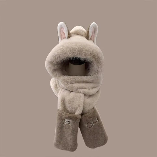 Plush animal-like head cover with ears and scarf on a beige background