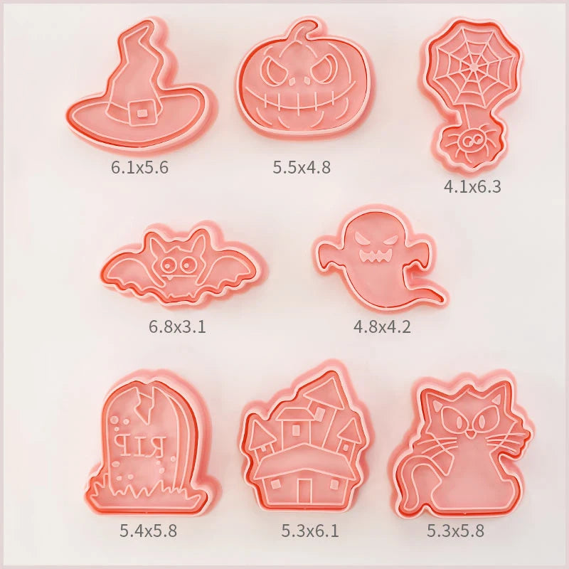 Set of Halloween-themed cookie cutters with measurements on a light pink background