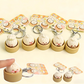 Set of cute keychains with smiling face designs in wooden holders on a white background.