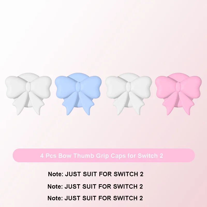 Four bow-shaped thumb grip caps in white, blue, and pink on a light pink background.