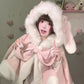 Woman holding bow of Kawaii  bunny hooded pink cloak 
