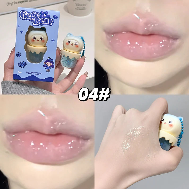 Product packaging of a small figurine held by a hand, with close-up shots of glossy lips and the product itself.