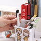 hand holding a pen in a pend holder