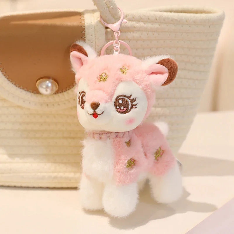 cute pink deer plushie keychain attached to a handbag