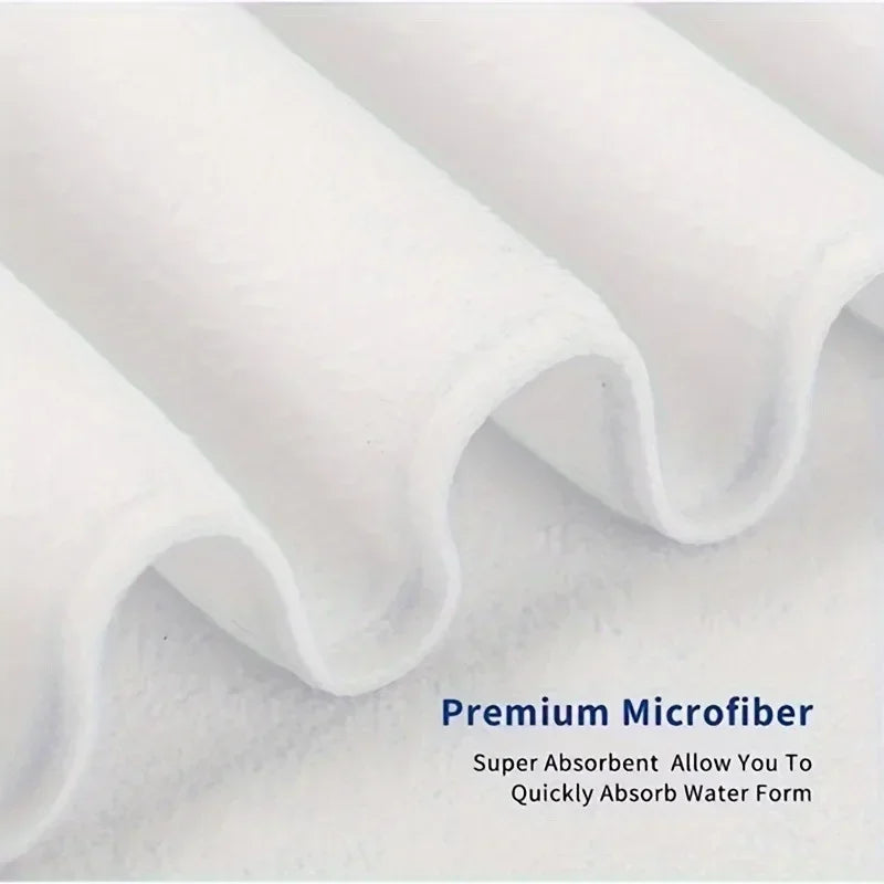 Close-up of premium microfiber fabric with text highlighting its absorbent properties.