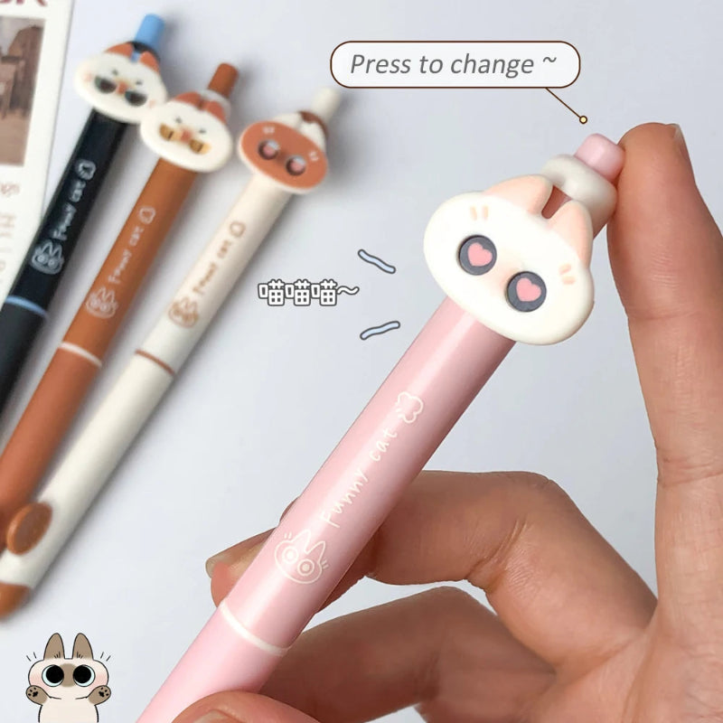 cute sassy cat Pink gel pen with a cartoon cat design on the cap, held by a hand.
