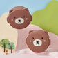 Two brown bear-shaped containers with a cute face design on a colorful background.