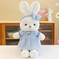 Miss Usagi Plushies, this is the white and blue design displayed on a white surface in front of a wooden cabinet.