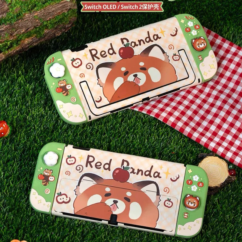 Two red panda-themed phone cases on grass with a checkered cloth in the background