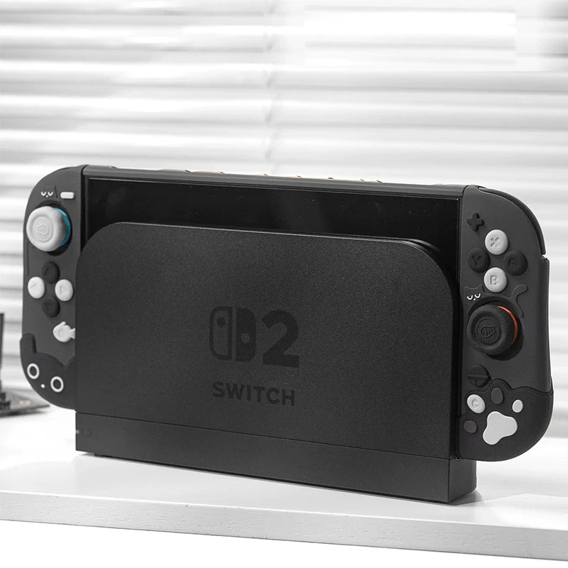 Black Nintendo Switch device on a white surface with a blurred background
