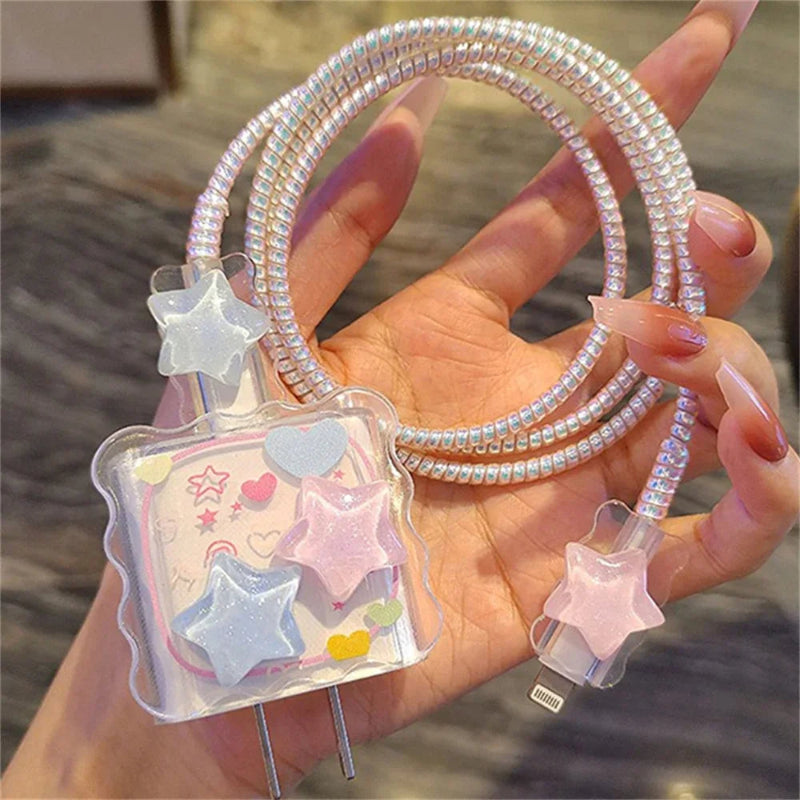 Transparent iphone charger cover  with star designs and a coiled cable held by a hand.