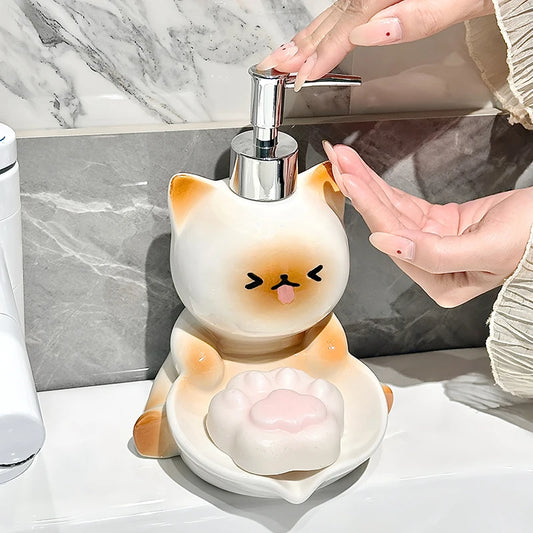 Cat-shaped soap dispenser with a person using it in a bathroom setting