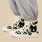 High-top sneakers with black cat designs on a beige background