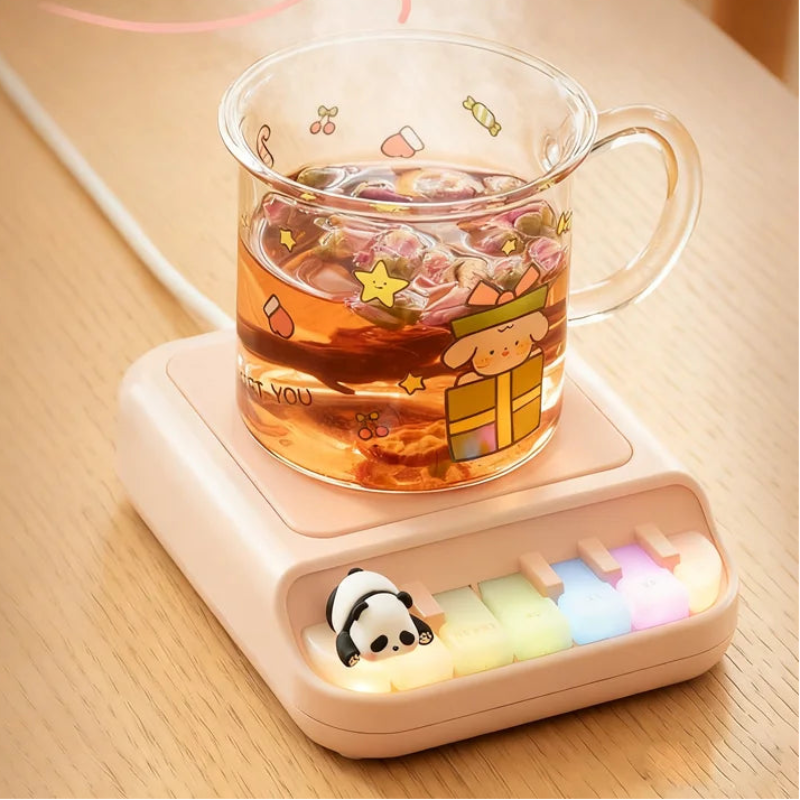 Pink Kawaii Panda Piano Cup Heater on a table