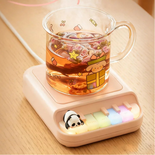 Pink Kawaii Panda Piano Cup Heater on a table