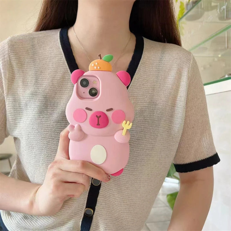 Person holding a pink capybara phone case