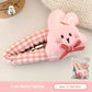 Cute bunny hairclip with checkers on a light background