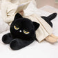 Woman resting her legs on a black Kawaii sleepy cat body pillow plushie