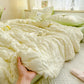 Green seersucker duvet set displayed on bed.