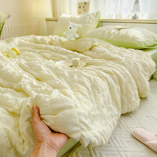 Green seersucker duvet set displayed on bed.