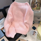 Rear view of a Kawaii Little Lamb Sweater displayed on a chair