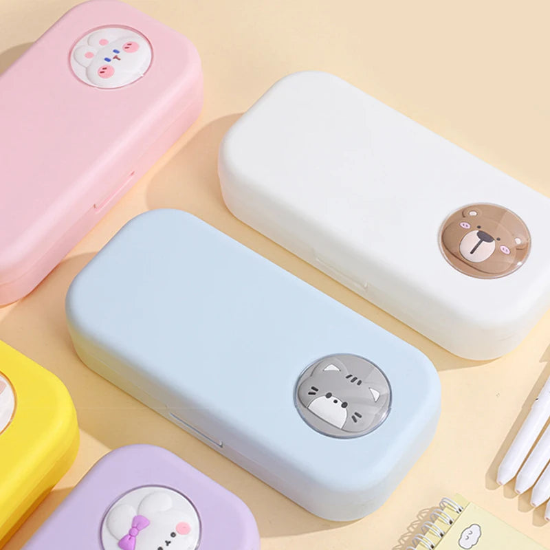 Colorful rectangular containers with cartoon character designs on a beige background