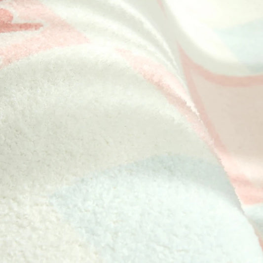 Close-up of a textured fabric with pink and white patterns
