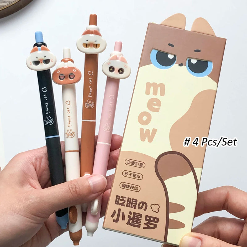 Set of four cute sassy cartoon-style pens with a cat-themed packaging box on a white background.