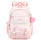 Pink and white backpack with pom-pom details on a white background