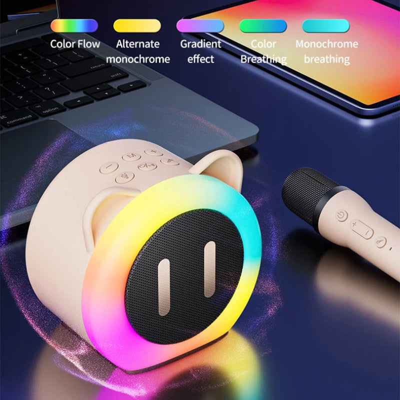 Cute Cat Mini Karaoke Speaker pink edition displayed on a back table top with the pink microphone next to it beside a laptop, this picture is informing you of the different ranges of light settings you can use.