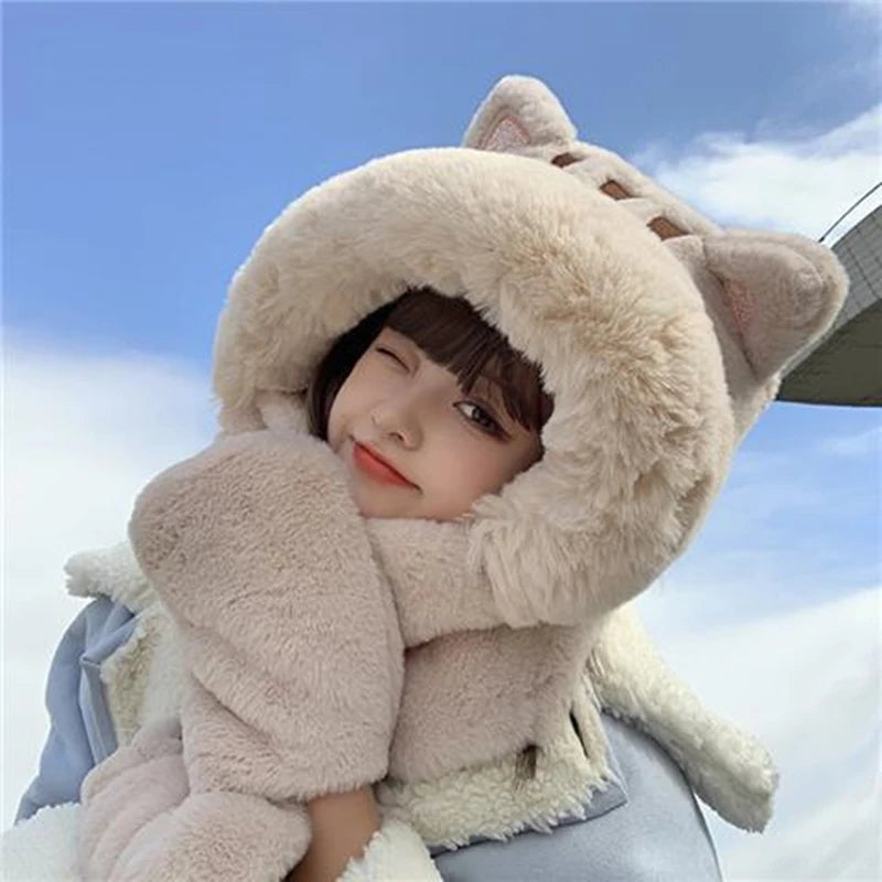 Person wearing a fluffy cat-themed hat against a blue sky.