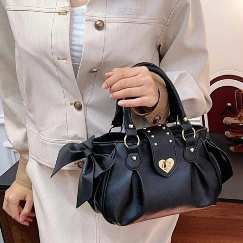 Kawaii Sweet Heart Lock Bag in black held by a woman