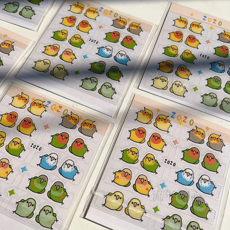 Colorful bird illustrations, these stickers are on a clear background, white paper behind the birds