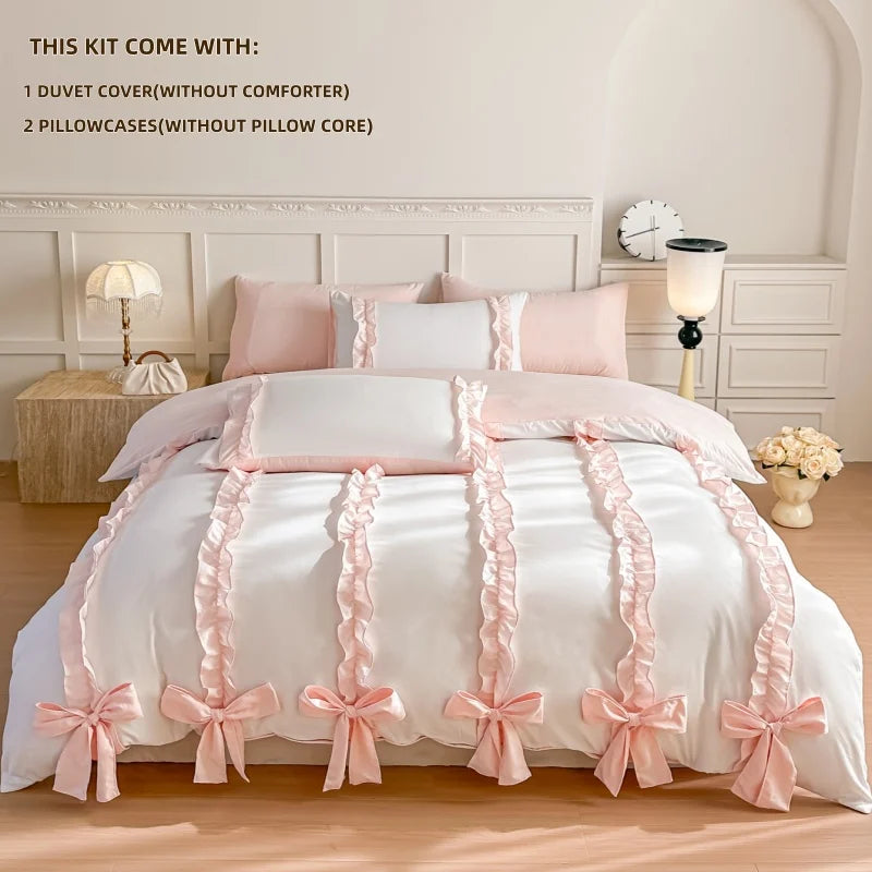 White duvet cover with pink bows and ribbons on a bed in a bedroom setting.