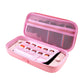 Pink Nintendo Switch case with zipper on a white background