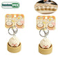 Two cute keychains shaped like buns in packaging with a white background.
