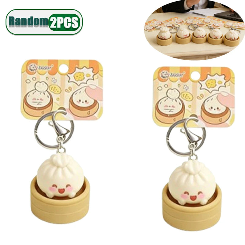 Two cute keychains shaped like buns in packaging with a white background.