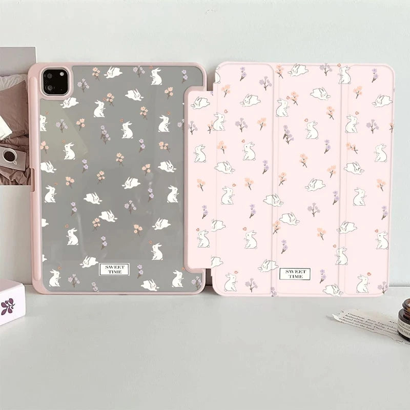 Kawaii tablet case with rabbit patterns on a light gray surface