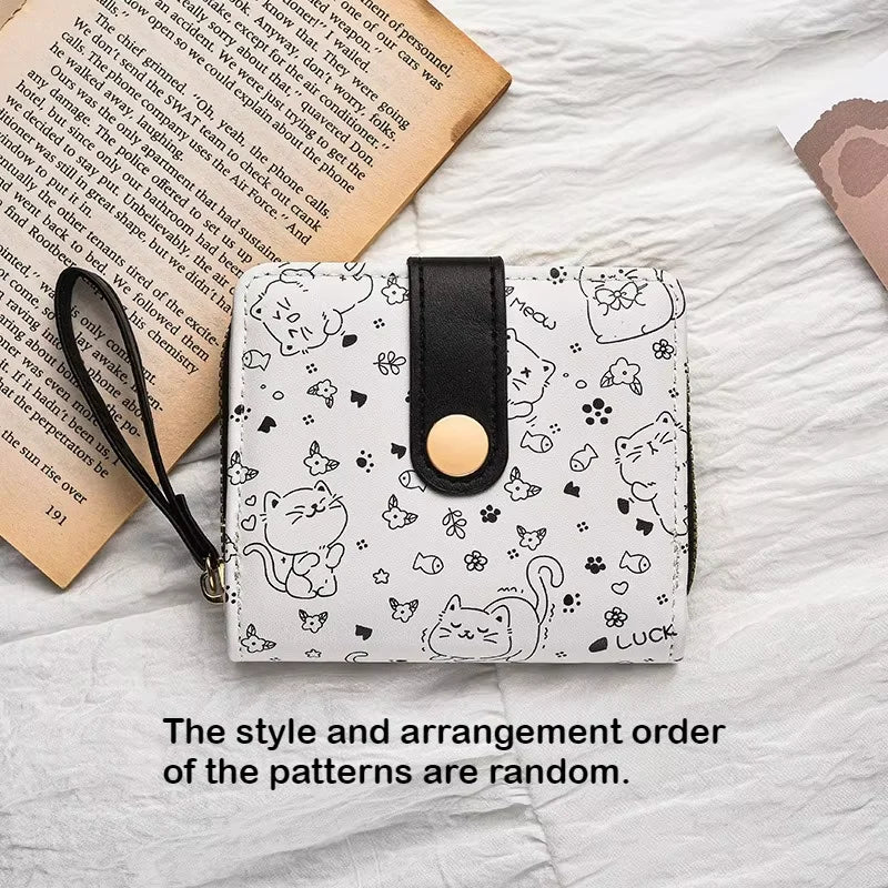 Small cute wallet with cat pattern on a textured surface