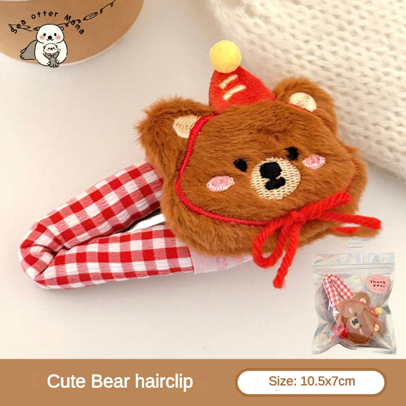 Cute bear hairclip with a red hat on a white background