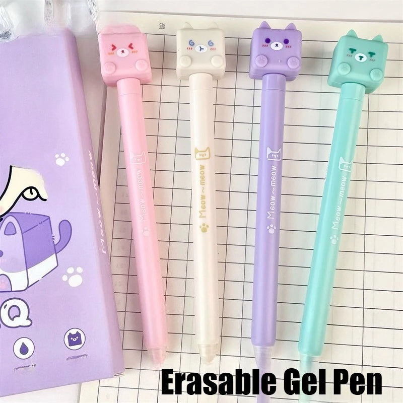 Kawaii Cat Erasable Gel Pens come in purple, pink , turquoise and cream all with different cute cats on them with different faces, this is displayed on a desk with notes in the background.