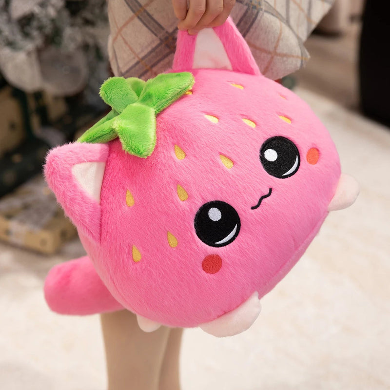 Front view of Kawaii Strawberry Cat Plushie held by a woman